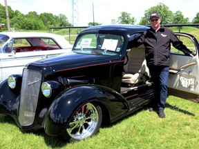 Bill Helmer showing off his PeopleÕs Choice Award-winning 1935 Chevrolet Master at the annual Lions Cruise held in Gananoque on June 4. Approximately 130 vehicles traveled to the event from Canada and New York State.Lorraine Payette/for Postmedia Network