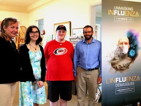 Museum staff greeted all comers at the new exhibit ÒUnmasking InfluenzaÓ. The presentation can be seen at the Thousand Islands History museum in Gananoque.  L-r, Joanne van Dreumal (museum director), volunteers Anna Collett and Isaac McClelland, and Mathew Thivierge (museum coordinator)  Lorraine Payette/for Postmedia Network