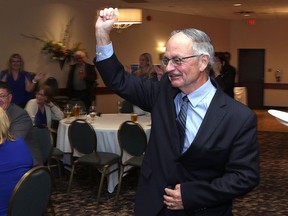 Progressive Conservative candidate Gary Bennett acknowledges the crowd at his election after-party at the Travelodge Hotel in Kingston late Thursday night.