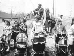 Can you identify any of these people who turned out in front of the old arena in Kirkland Lake to celebrate the coronation of King George VI and his wife Elizabeth on May 12, 1937?