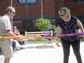Charles MacDonald, chair of the church council at Huron Shores United Church, left, and property team chair Deb Gill untied a ribbon Sat., June 4 to officially open the church's Community Living Room, which is open to all.