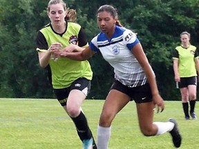 South Huron Rush player Sadie Smith, left, battles with a Southend player June 6 in London. Handout