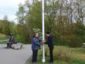Photo by KEVIN McSHEFFREY
Elliot Lake Pride emperor Steve Meawasige and Serpent River First Nation Ogimma (Chief) Brent Bissaillion raised the two-spirit flag at the Miners Memorial Park to mark the International Day Against Homophobia, Transphobia and Biphobia (IDAHOTB) on May 17.