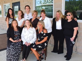 Photo by KEVIN McSHEFFREY
Oak Realty staff celebrated the grand opening of their new branch office in Spanish. Front row: Megan Woods, Donna Morris (broker of record) and Pam Sarich. Back row: Daria Olah, Erika Weller, Austin Brunet, Christine Brunet, Debbie Farrell, Tammy Greer-Ouellette (broker), and Valarie Ralp.