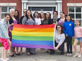 Staff from the Cochrane Public Library and the Town of Cochrane gathered at Town Hall with community members June 1 to raise the Pride flag. June 2022 has been proclaimed Pride Month in Cochrane to encourage further recognition, awareness, and education of the LGBTQ2S+ community. Pictured, from left, are Christina Noël-Blazecka, Alice Mercier, Sylvie Vezeau, Monika Malherbe, Vanessa Vachon, Véronique Bouchard, Jessica Horne, Jennifer Sisco, France Bouvier, Hillary Meaden, Ardis Chedore, Élodie Bouvier, and Millianne Bouvier. HEATHER BROUWER