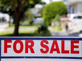 A house for sale sign is seen in a residential neighbourhood in this file photo.
(Files)