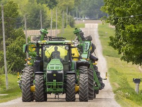 Farm equipment moves down a Southwestern Ontario road on May 26, 2022.  (Mike Hensen/The London Free Press)