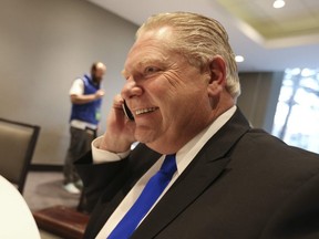 Doug Ford on the phone at the Ontario PC leadership convention on Saturday March 10, 2018.