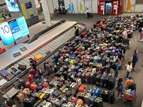 Airline passengers continue to report major delays at Pearson Airport in Toronto and mountains of luggage both on the tarmac and inside, as is seen here in this photo taken on Sunday, June 26, 2022.