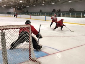 Veteran Lumber Kings defenceman Nathan Duck turns away from a team prospect during the team's summer evaluation camp.  45 players attended the camp that was held last weekend in Arnprior. Photo by Jamie Bramburger