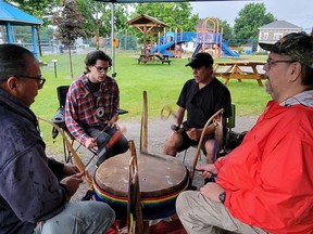 Members of the Bear Nation drum circle from Pikwakanagan drum at the opening of Indigenous Peoples Day celebrations in the City of Pembroke held at Rotary Park on July 21. Anthony Dixon