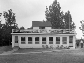 Shown here is the north side of the old clubhouse, with a balcony facing the golf course. Behind the windows is a dining room and lounge, part of the 1958 addition. The man in dark clothing is Bob Willis, the club's first golf pro. The building was moved and replaced by a new clubhouse in 1963. (Does anyone know where the old building was relocated?)
Photo: Museum Strathroy-Caradoc; Age Dispatch June 21, 1962