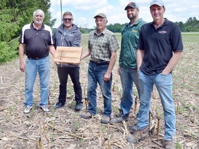 The winner of the Conservationist of the Year Award for 2022, presented by Ausable Bayfield Conservation Authority (ABCA), is Denys Farms Inc. – Jim, Dan and Mike Denys, of the Parkhill area. Presenting the award on June 9, from left to right, on behalf of the ABCA, are Adrian Cornelissen, the Municipality of North Middlesex representative on the ABCA board of directors; and ABCA stewardship manager Nathan Schoelier. Accepting the award, at the farm north of Parkhill, are Dan, Mike and Jim Denys. Handout