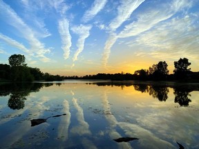 SUNSET STRIPS
Linear clouds reflected on Lake Margaret provide a beautiful reward for hikers and bikers on the popular 1.6-mile trail looping the St. Thomas lake earlier this week.
BARBARA TAYLOR/POSTMEDIA NEWS