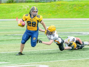 SABERCAT SPEED Kaylob Thibodeau of the Sault Sabercats flashes the running form that gained him 44 yards on six carries in a recent 48-0 Ontario Junior Varsity Football League victory over the North Bay Bulldogs. BOB DAVIES