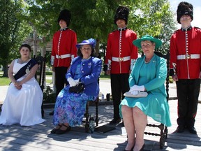 Theater Sarnia players narrated moments from Queen Elizabeth II's reign at a June 4 garden party in Sarnia's Germain Park, celebrating the Queen's Platinum Jubilee.  From left are Mia Abate, Kaleb Delorey, Denise Chaulk, Gianluca Pasqualucci, Maureen Crichton, and Mark McKelvie.  (Tyler Kula/ The Observer)