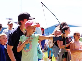 Kylie Cutler, 8, from Sarnia tries her hand at archery during Kids Funfest at Clearwater Park on Saturday, June 11, 2022 in Sarnia, Ont.  Terry Bridge/Sarnia Observer/Postmedia Network