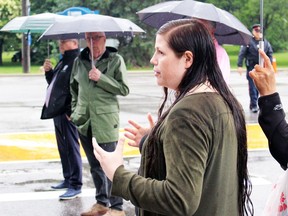 Candace Young, chairperson of the city's United Nations Declaration on the Rights of Indigenous Peoples committee, speaks Monday during a dedication ceremony for a new orange Cathcart Boulevard crosswalk, commemorating Indigenous children taken from their families and forced into residential schools. (Terry Bridge / Sarnia Observer)