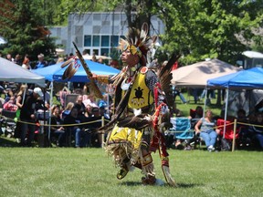 Jeff Plain, of Aamjiwnaang First Nation, dances Saturday on the opening day of the Aamjiwnaang Powwow.