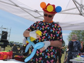 Jim Gill, of Giggle Time, was busy twisting balloons for a line of kids Sunday at the Sarnia Kinsmen Ribfest.