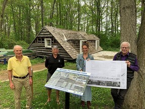 Save The Canatara Cabin members Paul Beaudet, left, and Roger Hay, are pictured with Blyth architect John Rutledge, right, and his intern Rémy Bles by the disassembled historical log cabin at the Lambton Heritage Museum in Grand Bend. (Submitted)