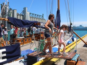 Jamie Kerwin, of Port Lambton, and Josie White, 5, of Petrolia, return to the Government Dock in Sarnia Friday after touring HMCS Oriole, a sailing ship that turned 101 this year. The training vessel and floating ambassador for the Royal Canadian Navy is currently touring the Great Lakes. Free tours will be offered Saturday and Sunday, 10 a.m. to 4 p.m.