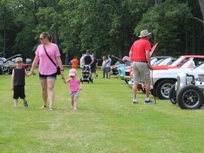Marie Hull, of Sarnia, walks with her children Brendan Hull, 5, and Paige Hull, 2, Sunday at Sarnia’s Canatara Park during Cruise in the Park.
