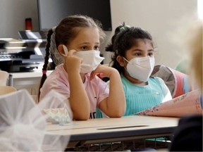 Students should wear masks if it makes them feel safer from COVID-19 and other viruses, health officials advise.  LEONHARD FOEGER/REUTERS