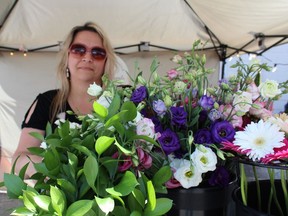 Cheryl Murphy-Simon, owner of Creme Brulee and Bouquets in Waterford, was one of the 50 vendors at the Norfolk Night Market held at the Simcoe fairgrounds on Friday, June 10 and Saturday, June 11. Murphy-Simon offered marketgoers an opportunity to make their own bouquets. MICHELLE RUBY