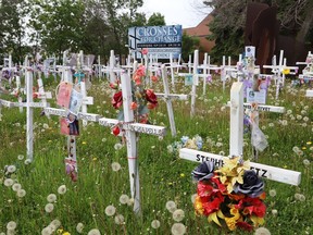 The site of Crosses for Change located at Brady Street and Paris Street in Sudbury, Ont. Each white cross is named for an individual lost to a drug overdose. John Lappa/Sudbury Star/Postmedia Network