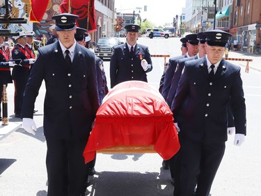 Pallbearers carry the casket of Greater Sudbury firefighter Mike Frost at a funeral service in downtown Sudbury, Ont. on Wednesday June 1, 2022. John Lappa/Sudbury Star/Postmedia Network