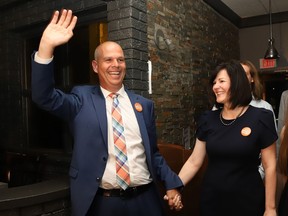 Sudbury NDP candidate Jamie West acknowledges supporters as his wife, Pam, looks on at his election night headquarters on Thursday night.