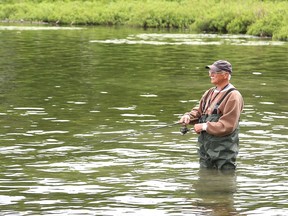 J.P. Mayer tests a lure while fishing at Ramsey Lake in Sudbury, Ont. on Tuesday June 7, 2022. John Lappa/Sudbury Star/Postmedia Network