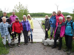 Members of Cycling Grannies transported and installed a bench on the Mount Ramsey Trail at the Lake Laurentian Conservation Area in Sudbury, Ont.  on Tuesday June 7, 2022. The group, which consists of 38 women, raised more $2,500 for the new bench.  John Lappa/Sudbury Star/Postmedia Network