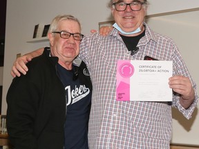 Stonewall Uprising activist Martin Boyce, left, joins Patrick Barnholden. A long-time teacher at Lo-Ellen Park Secondary School, Patrick Barnholden received the Stonewall Award for 2SLGBTQIA+ Action from the International Day of Pink. Supplied