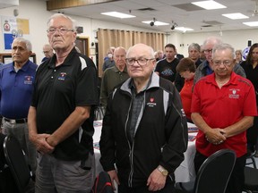 Participants take part in a moment of silence at the Workers' Memorial Day service at Branch 76 of the Royal Canadian Legion in Sudbury, Ont. on Monday June 20, 2022. John Lappa/Sudbury Star/Postmedia Network