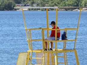 A lifeguard monitors the main beach at Bell Park in Sudbury, Ont. on Wednesday June 22, 2022. Seven municipal beaches have lifeguard supervision. The beaches include; Bell Park main beach, Capreol public beach on Marshy Lake, Kalmo Beach on Whitson Lake in Val Caron, Centennial Park Beach at 400 Graham Road in Whitefish, Moonlight Beach on Ramsey Lake, Nepahwin Beach on Nepahwin Lake, and Whitewater Lake Park on Whitewater Lake in Azilda. For more information on municipal beaches, visit https://www.greatersudbury.ca/play/beaches-and-lakes/beaches/. John Lappa/Sudbury Star/Postmedia Network