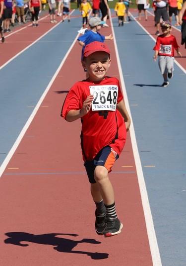 Xzander Roy, of A. B. Ellis Public School, runs to the finish line in a running event at the Rainbow District School Board Challenge Meet at Laurentian Community Track Complex in Sudbury, Ont. on Thursday June 23, 2022. About 330 students with special needs from 22 Rainbow schools participated in a variety of track and field events, including races, high jump, long jump, softball throw and shot put. John Lappa/Sudbury Star/Postmedia Network
