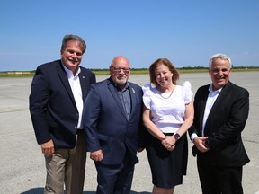 Todd Tripp, left, CEO of the Greater Sudbury Airport, Greater Sudbury Mayor Brian Bigger, Sudbury MP Viviane Lapointe and Nickel Belt MP Marc Serre were on hand for a $2.6-million funding announcement for the airport in Greater Sudbury on Tuesday.