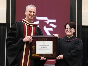 Katelyn Phillips of Redbridge (Occupational Therapist/Physiotherapist Assistant) receives the Governor General's Academic Medal from Cambrian College President Bill Best during this week's convocation ceremonies. Supplied