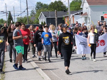 An estimated 50 school children from Grades 4-6 from Iroquois Falls Public School participated in the annual Law Enforcement Torch Run. The event was a reason to promote acceptance and inclusion of the Special Olympics and of people with intellectual disabilities for the estimated 50 school children who participated in the 3 km walk. A Special Olympian led the way, carrying a real Olympic torch, as the children carried homemade paper torches filled with red, orange and yellow tissue paper, in solidarity.

NICOLE STOFFMAN/The Daily Press