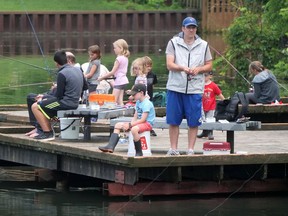Families fish from the Lake Lisgar boardwalk near the gazebo during the 2019 Tillsonburg Family Fishing Derby. This year's derby is July 2 and organizers are hoping for 'tremendous turnout.' CHRIS ABBOTT (File photo)
