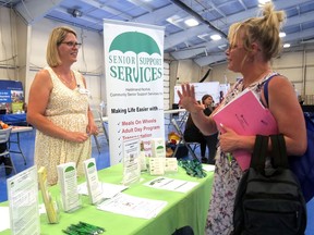 Brooke Crossett (on the right), seeking a job in the health care industry, speaks to Holly Mann from Haldimand-Norfolk Senior Support Services at Wednesday's job fair in Simcoe. CHRIS ABBOTT