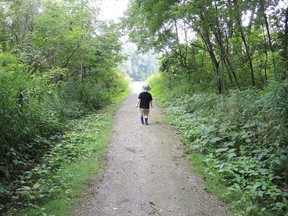 A boy walks through a trail at a conservation area. Some of the St. Clair Region Conservation Authority trails will be closed later this year due to renovations. (Handout/Postmedia Network)
