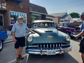 Larry Schneider poses with his 1952 Dodge DeSoto with original paint and interior. It was originally purchased by his wife's family and was passed down to his wife, Gwen. Victoria Acres