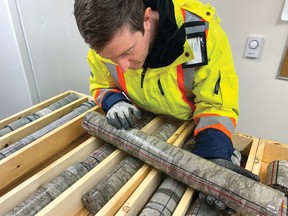 A senior geoscientist at the NWMO examines core samples pulled from rock in South Bruce, Ont., as part of investigations into the safe storage of used nuclear fuel inside a proposed deep geological repository in the area. Photo submitted.
