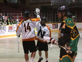 Pat Saunders and Riley Thompson celebrate Thompson's second period goal as the Owen Sound Bug Juice North Stars host the Ennismore James Gang in Ontario Series Lacrosse action Saturday, June 11, 2022, inside the Harry Lumley Bayshore Community Centre. Greg Cowan/The Sun Times