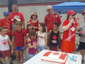 Children are shown joining in for 'O Canada' at the beginning of Friday's Canada Day event in Wallaceburg at the Kinsmen Community Centre.  (Trevor Terfloth/The Daily News)