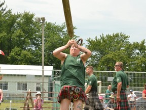 Heather Boundy, the Guinness World Record holder for most cabers thrown in three minutes (15), competed in the heavy events at the Embro Highland Games Friday. Pictured, Boundy demonstrates her caber toss. (Galen Simmons/The Beacon Herald)