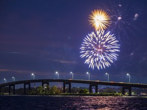 Canada Day fireworks light up the sky above the Bay Bridge on Friday evening in Belleville, Ontario. ALEX FILIPE